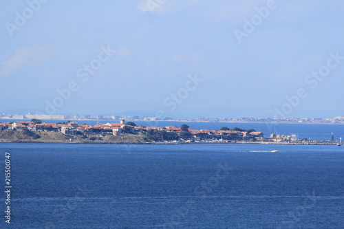 blue sea and sky, a view of the coastal strip with houses and beaches © Kseniya