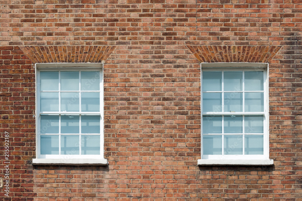 Fragment of brick wall with two windows