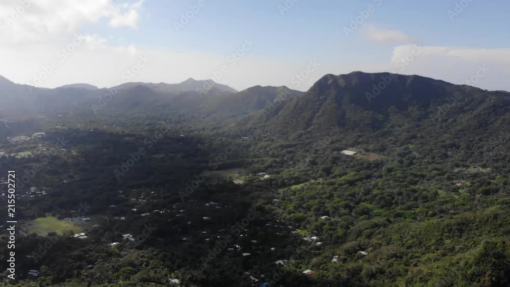 Aerial Drone Flying Over El Valle de Anton or Anton Valley in Panama with lush rain forests, the beautiful town in the caldera and blue skies with clouds on a bright day Aerial Drone Flying Over El Valle de Anton or Anton Valley in Panama with lush rain forests, the beautiful town in the caldera and blue skies with clouds on a bright day