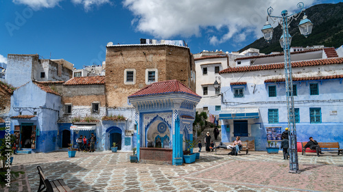 Chefchaouen medina center with unidentified people, blue city skyline on the hill, Morocco © CanYalicn