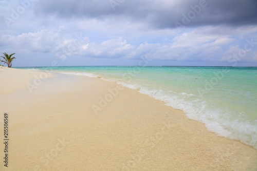 Amazing tropical landscape view. White sand beach , turquoise water and blue sky with white clouds. Gorgeous nature background. Maldives, Indian Ocean.Amazing tropical landscape view. White sand beac