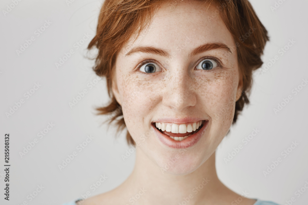 Close-up portrait of weird and funny good-looking european with ginger hair smiling like crazy and staring at camera. Girl addicted with sweets and can not resist from buying kilos of them Close-up portrait of weird and funny good-looking european with ginger hair smiling like crazy and staring at camera. Girl addicted with sweets and can not resist from buying kilos of them