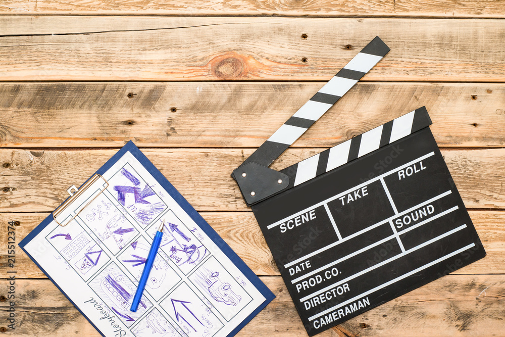 Fototapeta premium clapperboard, storyboard on wood