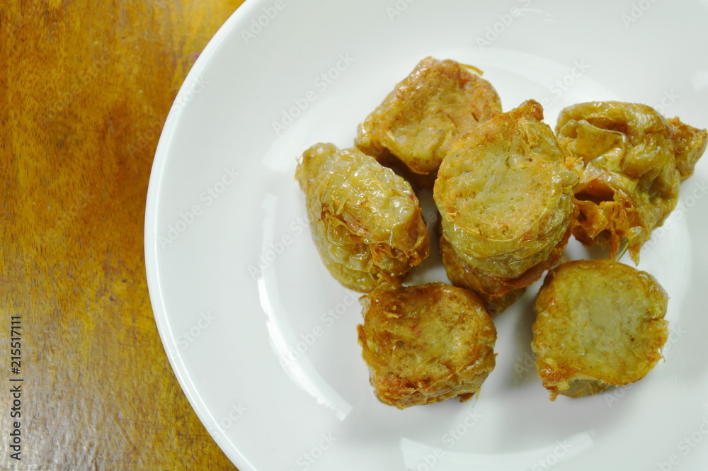 crispy deep fried crab meat roll in flour on plate