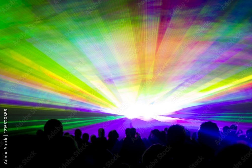 Rainbow laser show. Very colorful show with a crowd silhouette and great laser rays at youth party festival Rainbow laser show. Very colorful show with a crowd silhouette and great laser rays at youth party festival