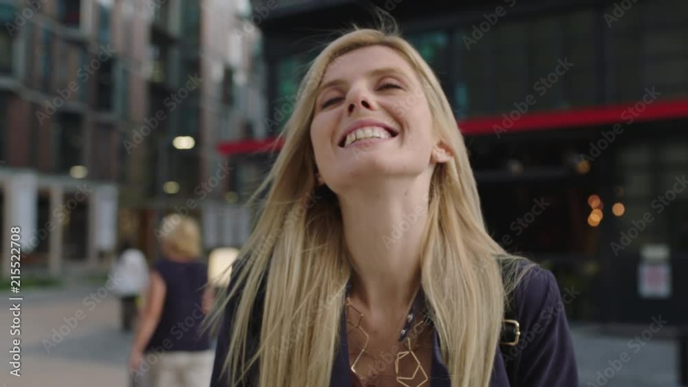 portrait of young beautiful blonde woman smiling happy enjoying urban lifestyle portrait of young beautiful blonde woman smiling happy enjoying urban lifestyle