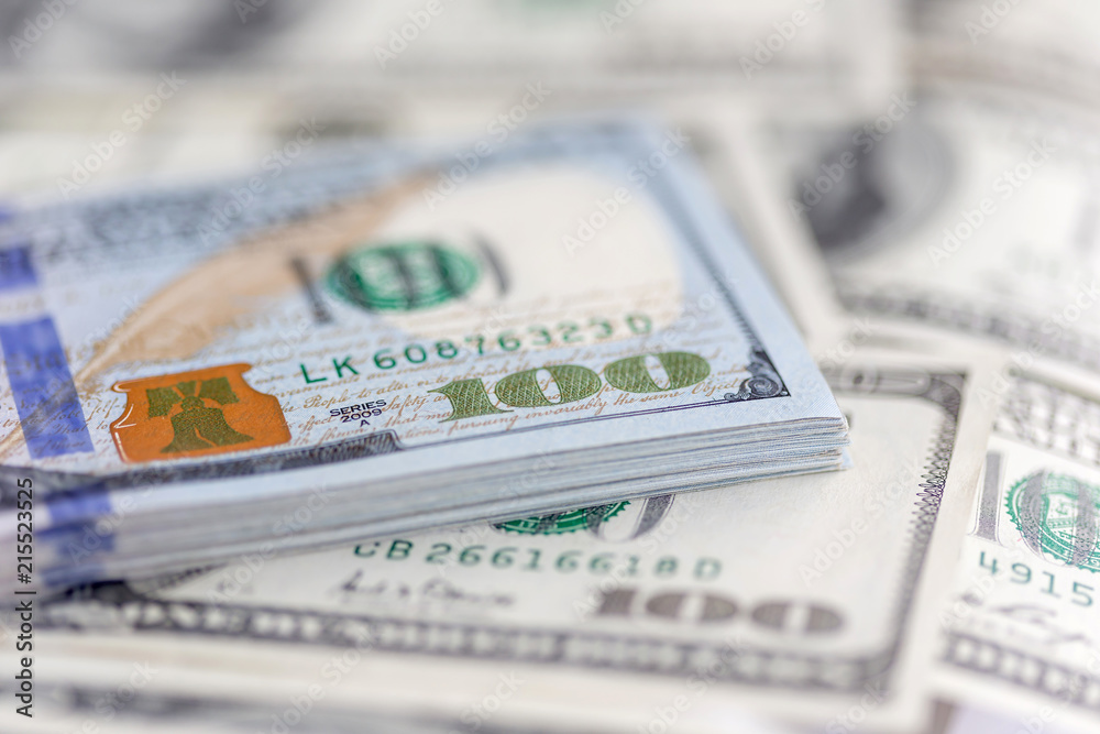 Stack of hundred dollar bills, banknotes of hundred, closeup