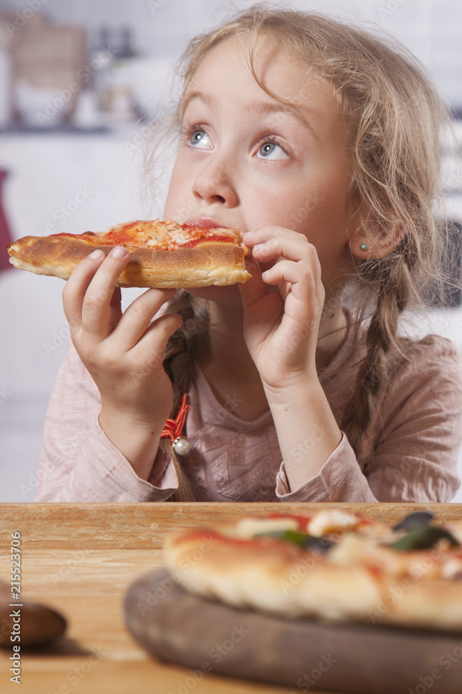Little child girl holding pizza slices as symbol of best food. (Joy, childhood, nutrition concept) Little child girl holding pizza slices as symbol of best food. (Joy, childhood, nutrition concept)