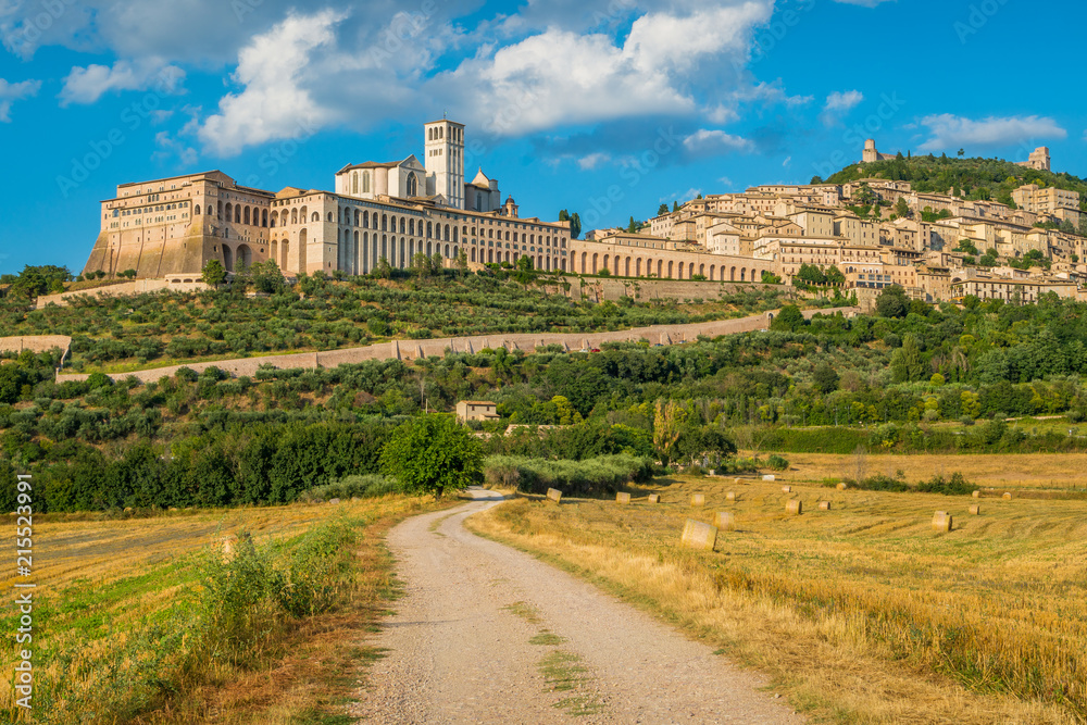 Panoramic view of Assisi, in the Province of Perugia, in the Umbria region of Italy. - obrazy, fototapety, plakaty 