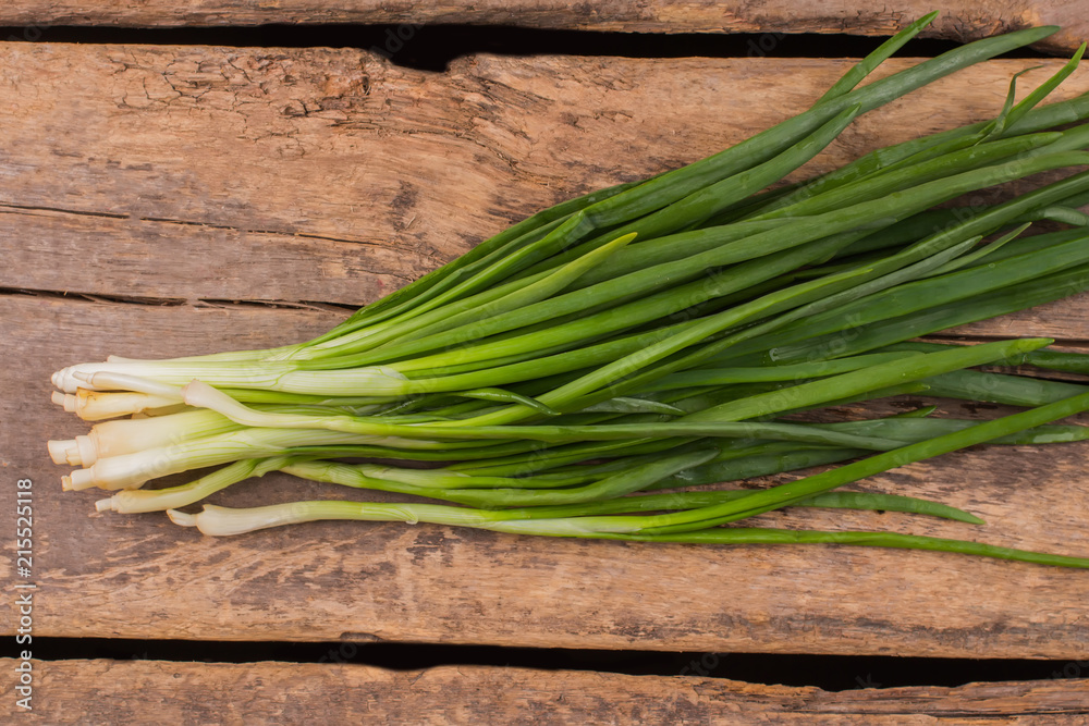 Bunch of green onion. Old rustic wooden table background. Bunch of green onion. Old rustic wooden table background.