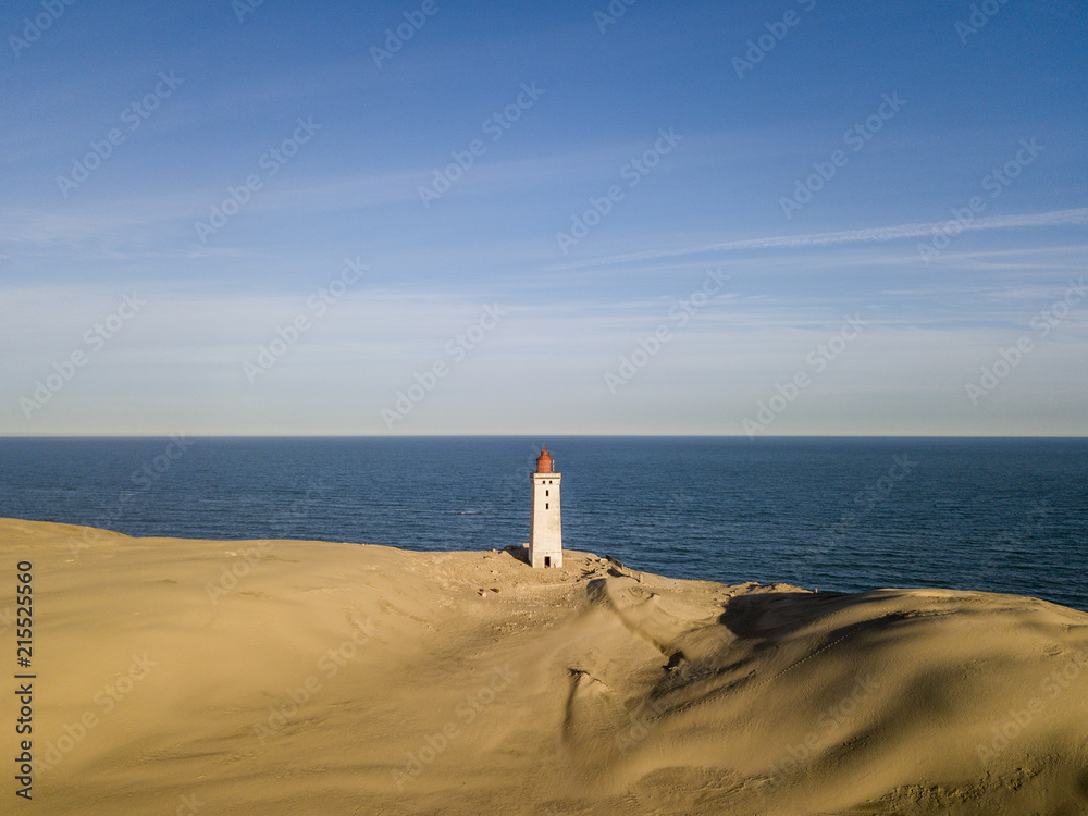 Aerial view of Rubjerg Knude lighthouse buried in sands on the coast of the North Sea