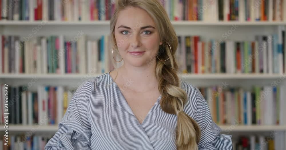 portrait beautiful young blonde woman student smiling confident independent in library background portrait beautiful young blonde woman student smiling confident independent in library background