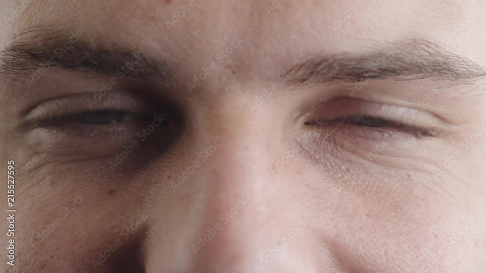 close up happy man blue eyes looking blinking caucasian male healthy eyesight optical sense close up happy man blue eyes looking blinking caucasian male healthy eyesight optical sense
