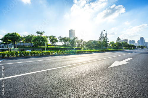 Fototapeta Naklejka Na Ścianę i Meble -  asphalt road with city skyline