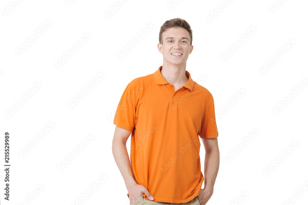 Friendly looking european guy wearing orange shirt smiling standing over  white background Stock Photo | Adobe Stock
