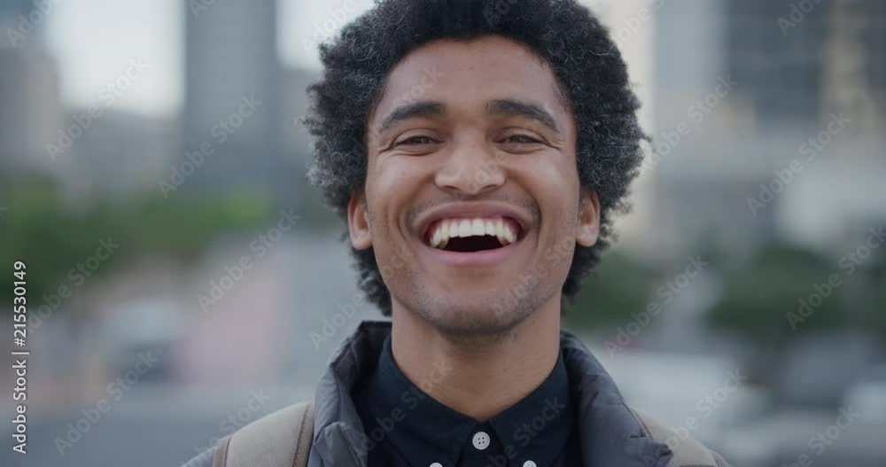 portrait independent young mixed race businessman laughing enjoying professional urban lifestyle in city cheerful male afro hairstyle slow motion portrait independent young mixed race businessman laughing enjoying professional urban lifestyle in city cheerful male afro hairstyle slow motion