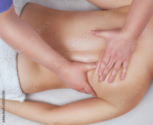 The masseur makes massage on the neck and back of the patient in the beauty salon. Medical assistance for the body.