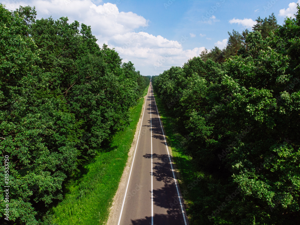 aerial view of straight highway. sunny day. car travel concept aerial view of straight highway. sunny day. car travel concept