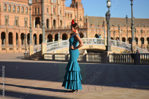 The beautiful Spanish girl with green flamenco dress