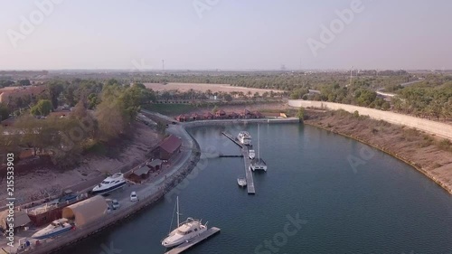 Beautiful drone view over mavelous boat dock in Abu Dhabi. Forvard camera movement. photo