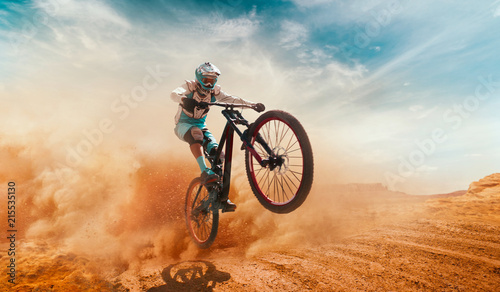 Cyclist riding a bicycle. Downhill. photo