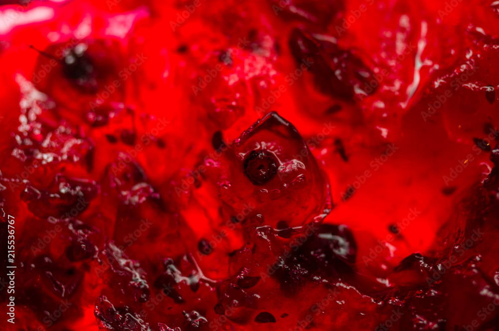 Bright translucent red currant jam in a glass jar Bright translucent red currant jam in a glass jar