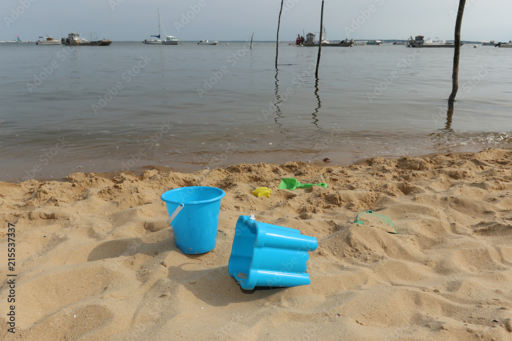 buckets of children beach on the sand of the Atlantic at Arcachon Basin of Cap Ferret buckets of children beach on the sand of the Atlantic at Arcachon Basin of Cap Ferret