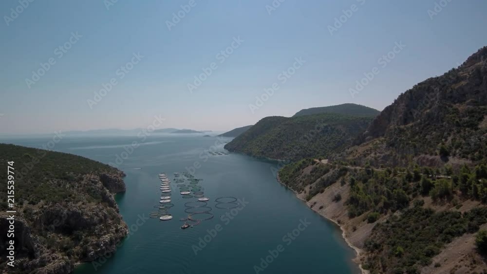 Aerial shot of a fish farm in Greece located in Saronic gulf near Sofiko village. Aerial shot of a fish farm in Greece located in Saronic gulf near Sofiko village.