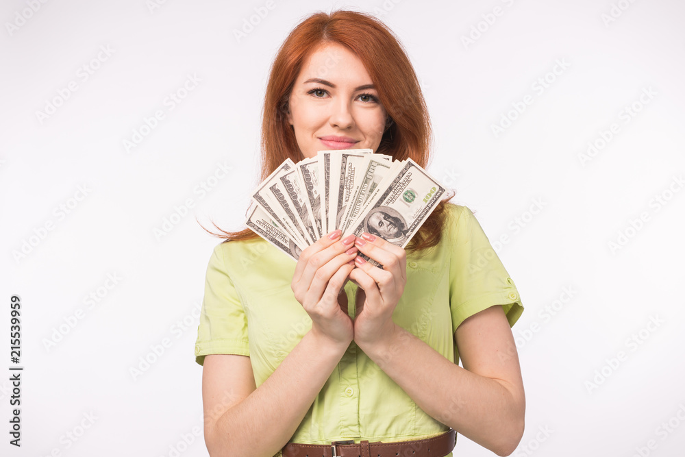 Redhead woman with money on white background Redhead woman with money on white background
