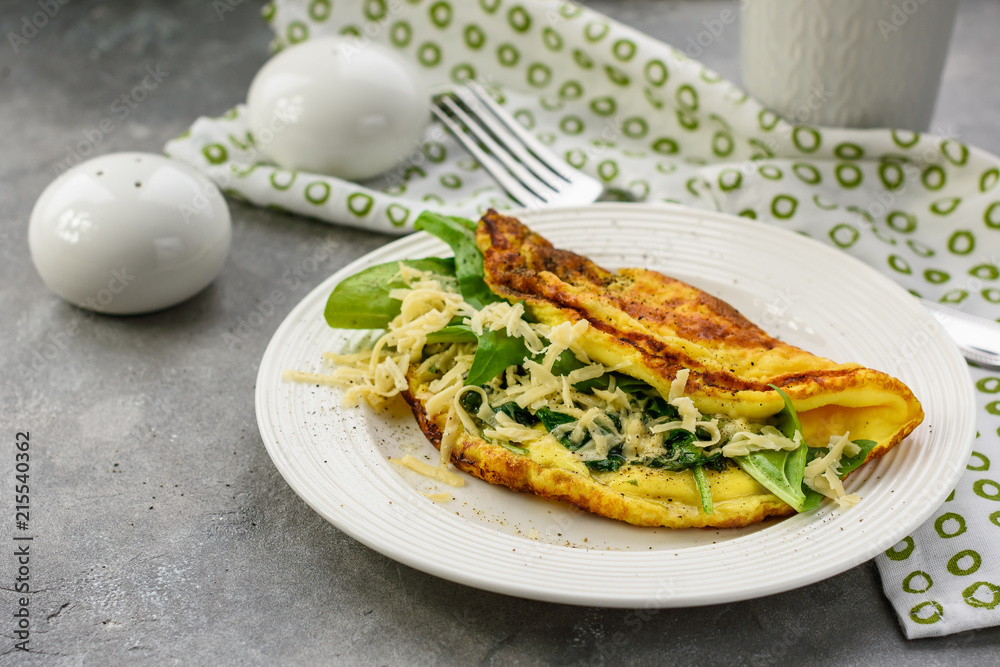 Omelette with spinach and cheese. Omelette with spinach and cheese.