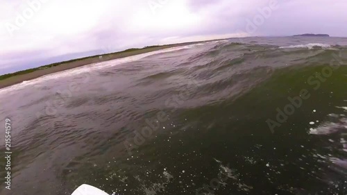 FPV POV slow motion surfing in Japan Shonan Tsujido purple dark beach. photo