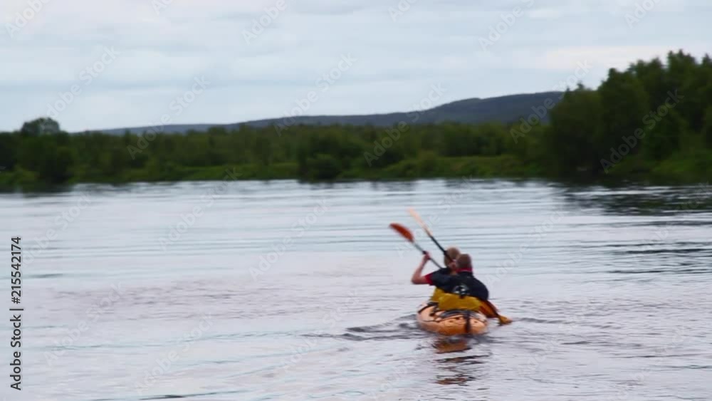 Following and Passing Two Men Tandem Kayak in Sweden Following and Passing Two Men Tandem Kayak in Sweden