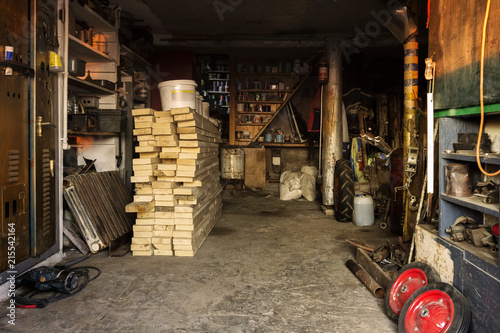 Billede på lærred interior of a rural barn with a workshop and a repository of materials
