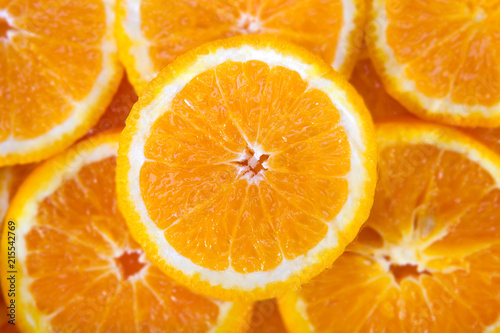Colorful orange citrus fruit slices background top view