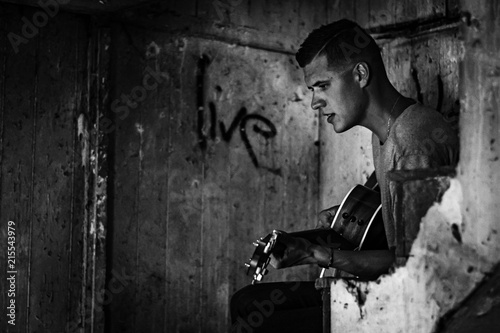 man playing acoustic guitar © kyle