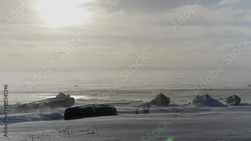 Grounded freighter canoes, windy winter snow, northern Quebec on James Bay photo