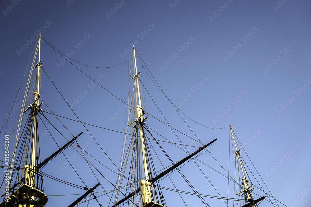 yacht masts against a dark blue sky yacht masts against a dark blue sky