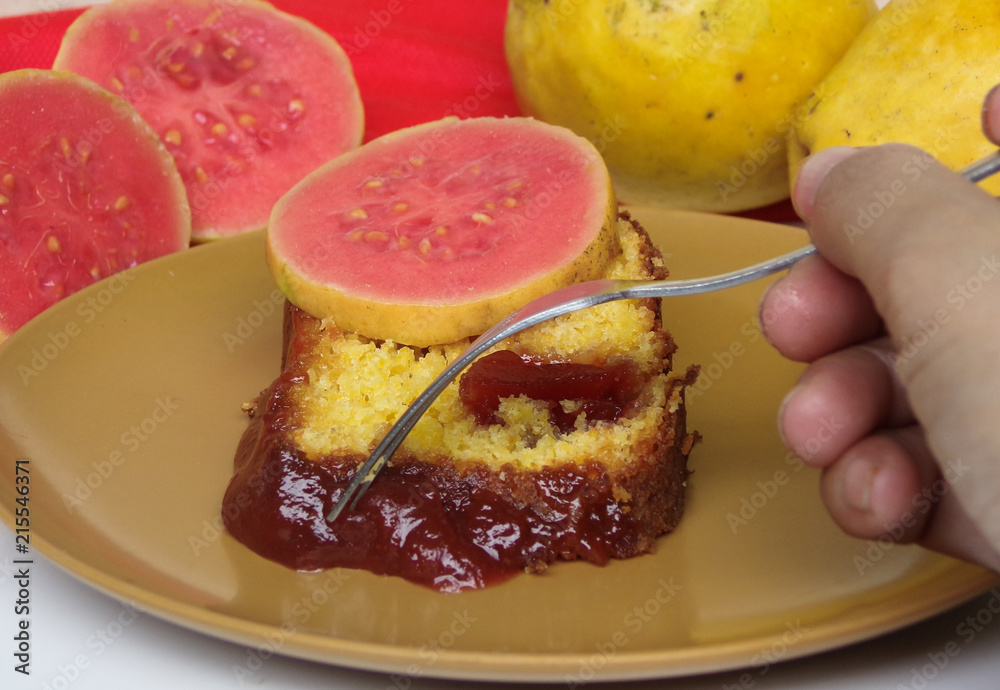 Typical Brazilian sweet dessert corn cake with guava paste. And guavas fruits  composing the scene.