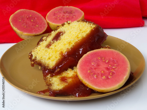 Typical Brazilian sweet dessert corn cake with guava paste. And guavas fruits  composing the scene.