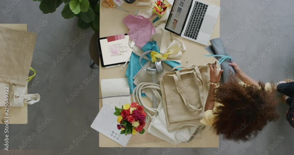 young fashion designers women packaging stylish handbags ready for courier shipment creative female entrepreneurs in small startup business overhead