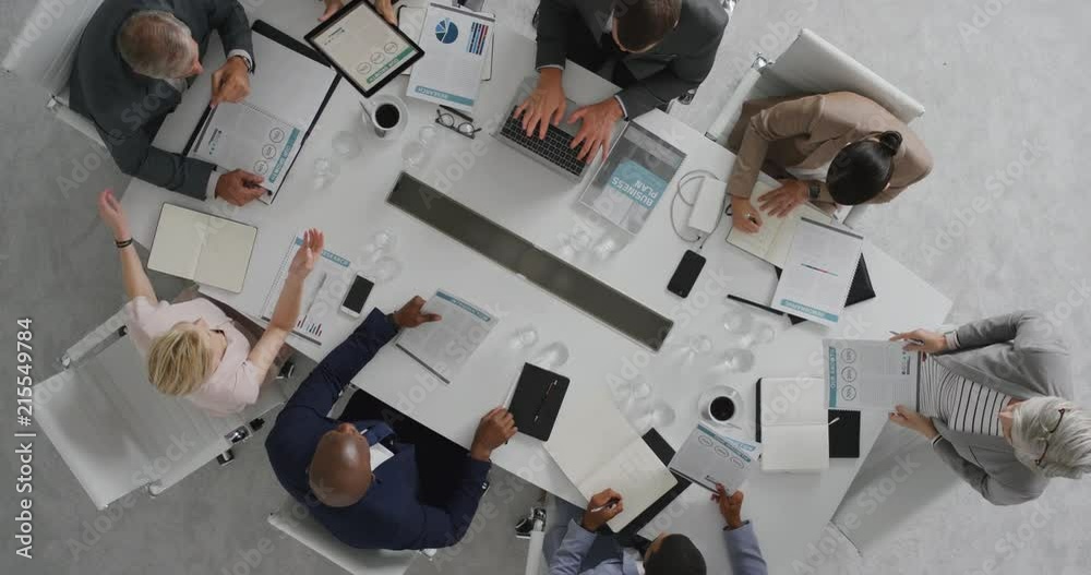 professional business people meeting in boardroom multi ethnic corporate leaders collaborating sharing ideas planning strategy using tablet pc overhead