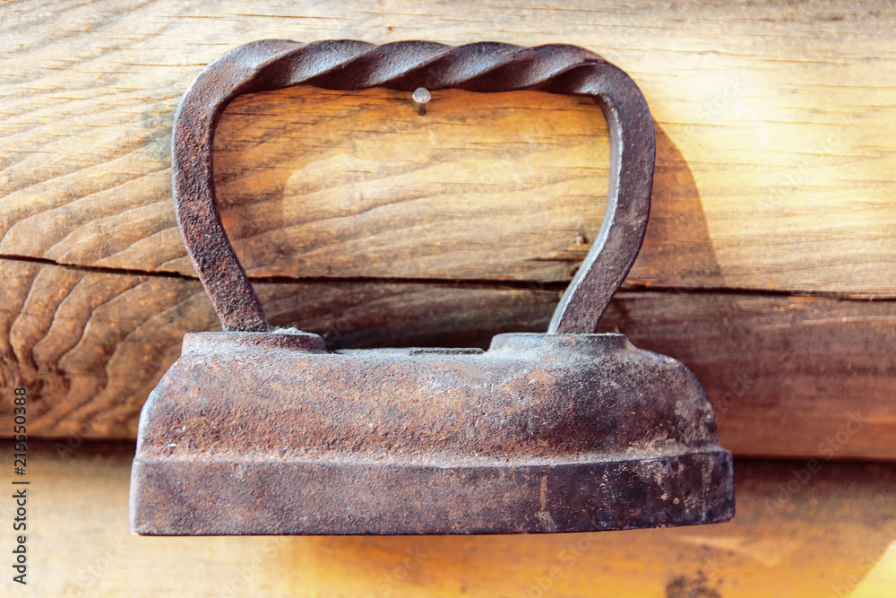 old iron on the wall in the old house