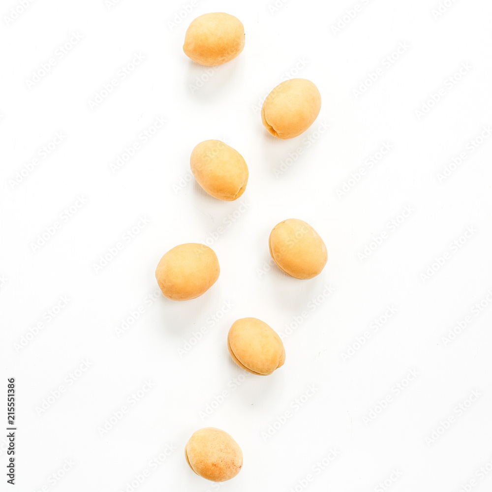 Yellow apricots isolated on white background. Flat lay, top view. Yellow apricots isolated on white background. Flat lay, top view.