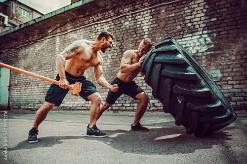 Tableau sur toile Two muscular athletes training