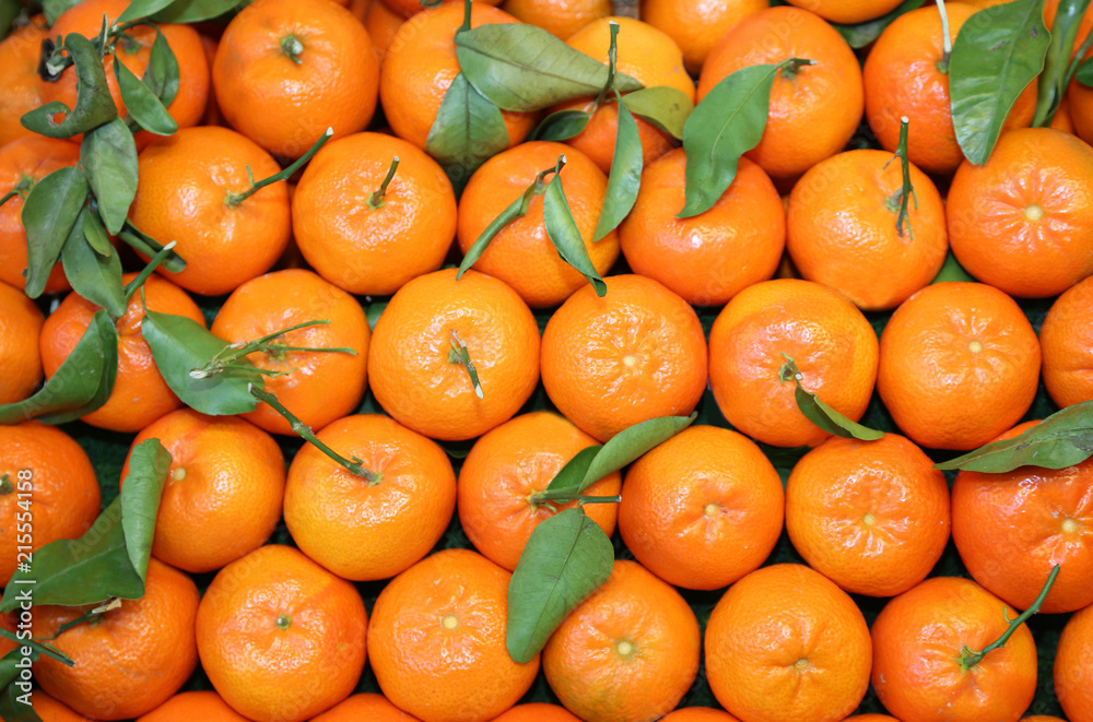 background of small Sicilian orange mandarins