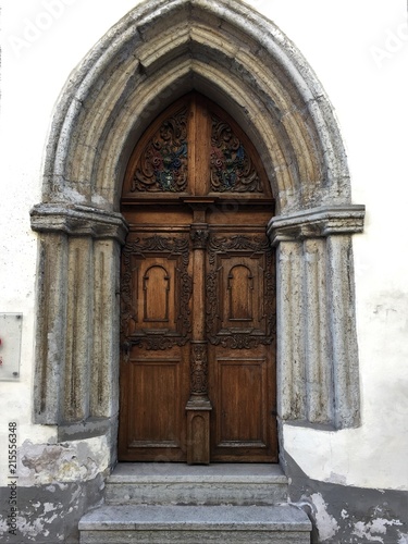 Old Wooden Gothic Arch Door with Stone Frame
