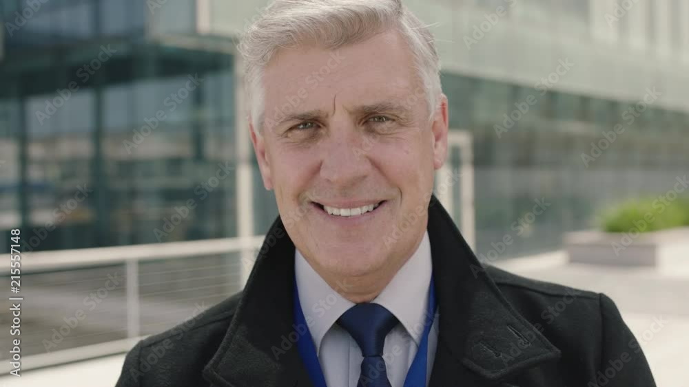 close up portrait of successful mature ceo businessman smiling happy enjoying corporate lifestyle in urban city background close up portrait of successful mature ceo businessman smiling happy enjoying corporate lifestyle in urban city background