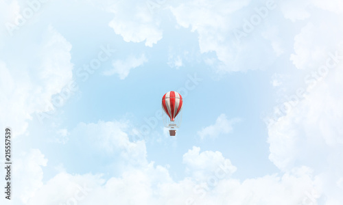 Flying hot air balloon in the air.