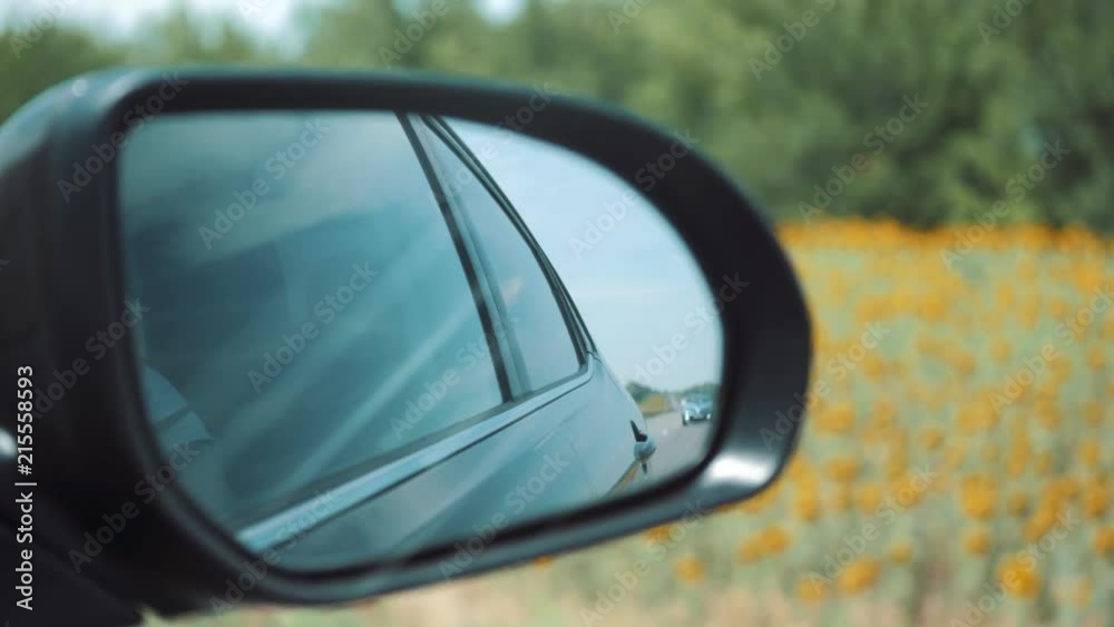 Side rear view mirror in motion large Side rear view mirror in motion large