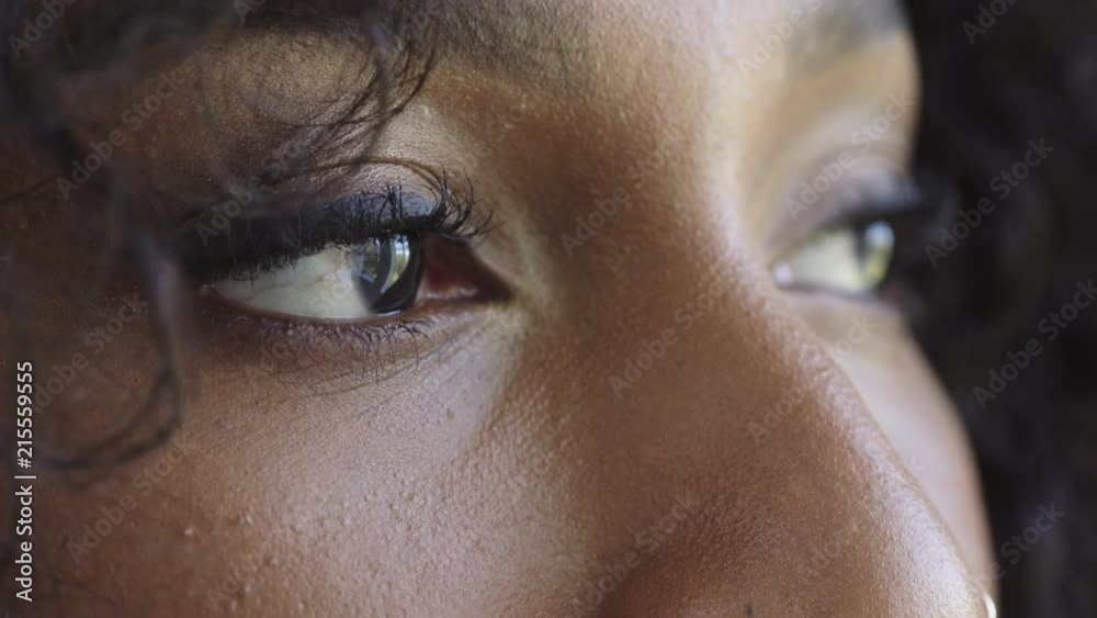 close up beautiful african american woman eyes open looking pensive contemplative blinking healthy eyesight